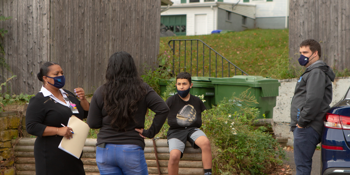 Mentor with students outside.